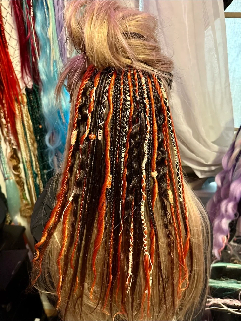 Blonde Hair Extensions with Black and Orange Braided Accents